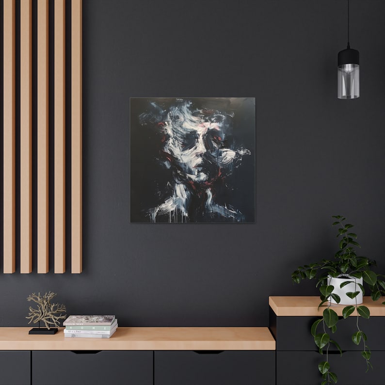 May include: Abstract portrait painting on canvas. The artwork features a face rendered in white, red, and black brushstrokes against a dark background. The painting is mounted on a wall above a wooden cabinet.