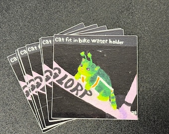Alien Cat Meme Sticker: Cat fit in bike water holder reddit