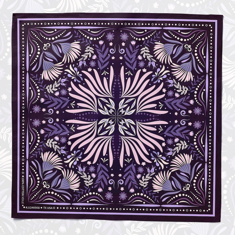 May include: Purple bandana with a floral pattern in shades of pink, white, and purple. The bandana has a border of white dots and a repeating pattern of small flowers and leaves. The text "100% COTTON VOILE" and "#JJ24056G TX USA" is printed in white on the bottom edge of the bandana.