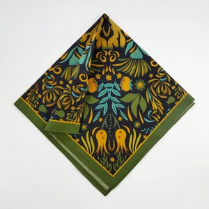May include: A green and black bandana with a floral pattern in yellow, orange, and teal. The pattern features stylized flowers, leaves, and geometric shapes.