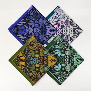 May include: Four fabric squares with a floral pattern. The squares are in different colors: blue, green, yellow, and purple. Each square has a number printed on it: 4055T, 4055D, 4056B, and 4056C.