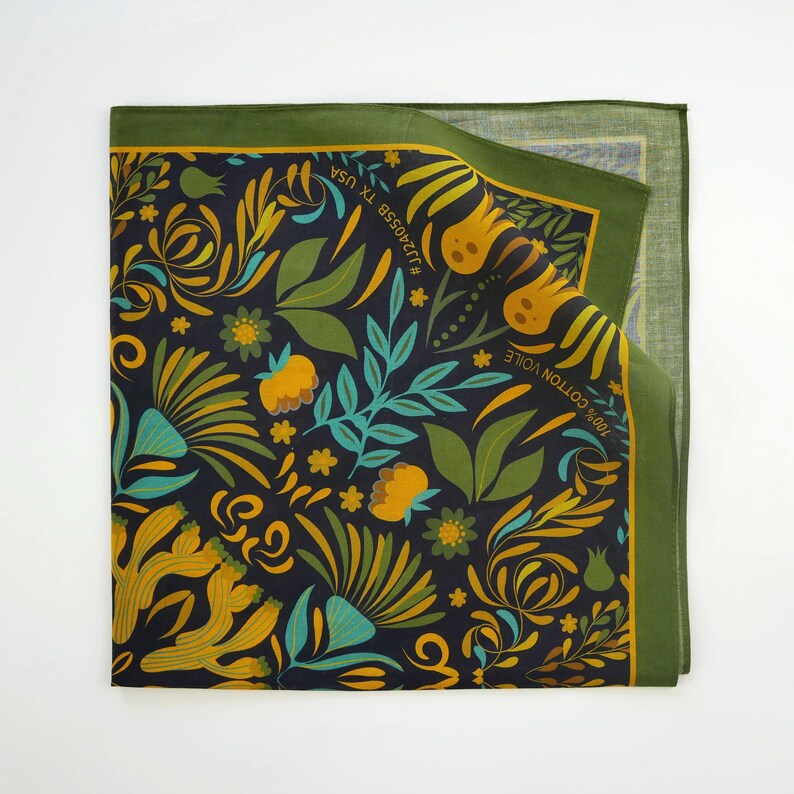 May include: A green and yellow floral patterned bandana with the text "100% COTTON VOILE" and "#JULIASSE TX USA" printed on it.