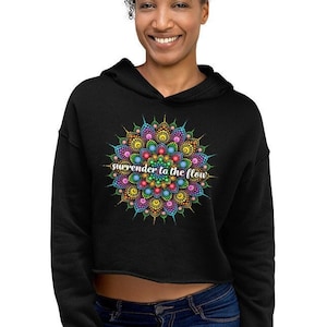 May include: A black cropped hoodie with a colorful mandala design and the text "surrender to the flow" in white.