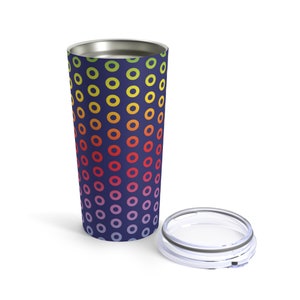 May include: A stainless steel tumbler with a rainbow colored circle pattern on a dark blue background. The tumbler has a clear lid.