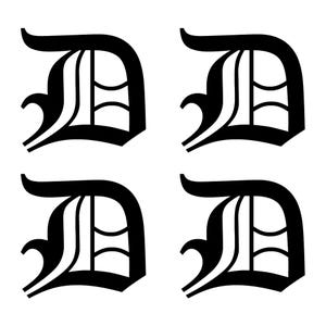 May include: Four black letter "D" graphics in a classic, stylized font. Each letter is bold with a decorative flourish and a distinctive inner design. The letters are evenly spaced against a white background.