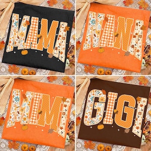 May include: Four t-shirts in black, orange, and brown featuring large block letters spelling MAMA, NANA, MIMI, and GIGI. The letters have a scalloped edge and are filled with patterns of autumn leaves, flowers, pumpkins, acorns, and plaid.