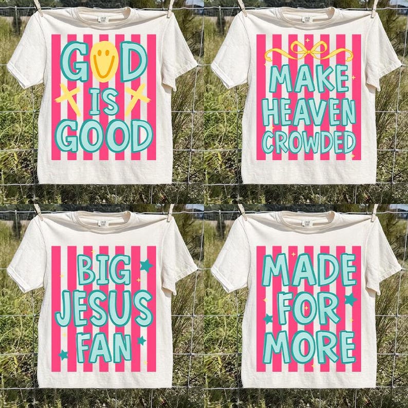 May include: Four white t-shirts with different phrases printed on them. Each shirt has a unique design with text in teal and pink, including "GOD IS GOOD", "MAKE HEAVEN CROWDED", "BIG JESUS FAN", and "MADE FOR MORE".