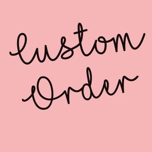 May include: A pink background with the words "Custom Order" written in black cursive script. The text is centered and takes up most of the image.