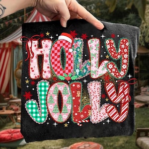 May include: Black fabric with the words "HOLLY JOLLY" in colorful, patterned letters. The letters feature Christmas-themed designs like cherries, plaid, floral, and candy canes. A Santa hat sits atop the letter "O".