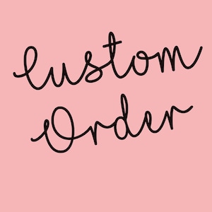 May include: A pink background with the words "Custom Order" written in black cursive script. The text is centered and the overall design is simple and clean.
