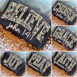 May include: A collection of black t-shirts with various inspirational words in a camouflage pattern. The words "BELIEVE", "CHOSEN", "GRACE", "JOY", "PRAY", and "FAITH" are displayed with corresponding Bible verses. The shirts are on a leopard print background.