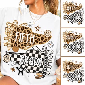 May include: A white t-shirt featuring a graphic design of two pennants. The top pennant has a leopard print pattern with the text FIFTH, and the bottom pennant has a black and white checkerboard pattern with the text GRADE, accented by stars and flowers.