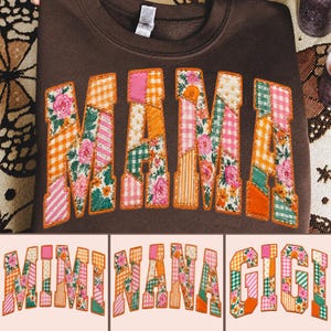May include: A dark brown crewneck sweatshirt featuring the word MAMA in large, block-style letters. Each letter is filled with a patchwork of colourful floral, gingham, and striped fabric patterns in shades of pink, orange, green, and white.