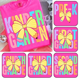 May include: A bright pink t-shirt with the word "KINDERGARTEN" in colorful letters and a yellow bow with pencil accents. Also, there are six pink squares with grade level text and bow pencil graphics.