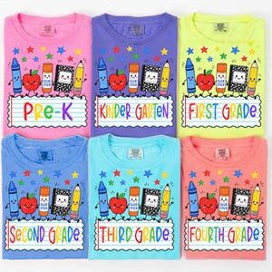 May include: Six t-shirts in pink, purple, neon yellow, blue, light blue, and coral, each featuring a graphic of a crayon, apple, glue stick, notebook, and pencil above lined paper text reading Pre-K, Kindergarten, First, Second, Third, and Fourth Grade.