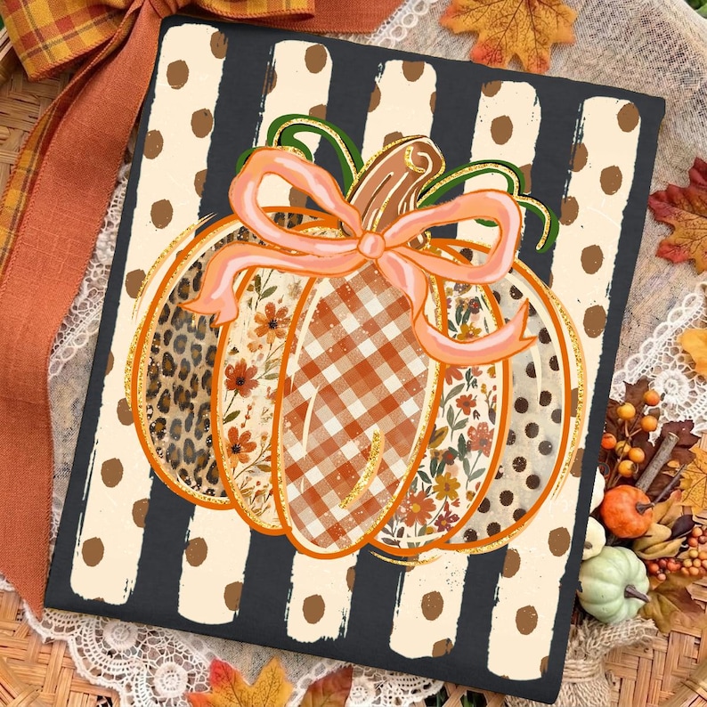 May include: A rectangular sign featuring a central pumpkin illustration with segments of leopard print, floral patterns, and orange gingham. A light pink bow sits atop the pumpkin, set against a black and cream vertical striped background with dots.