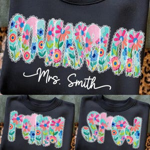 May include: Black sweatshirt with the word "Counselor" in a floral design, with the name "Mrs. Smith" below. The floral design includes pink, blue, and orange flowers. Additional sweatshirts with the words "Mom" and "Shaw" are also shown.