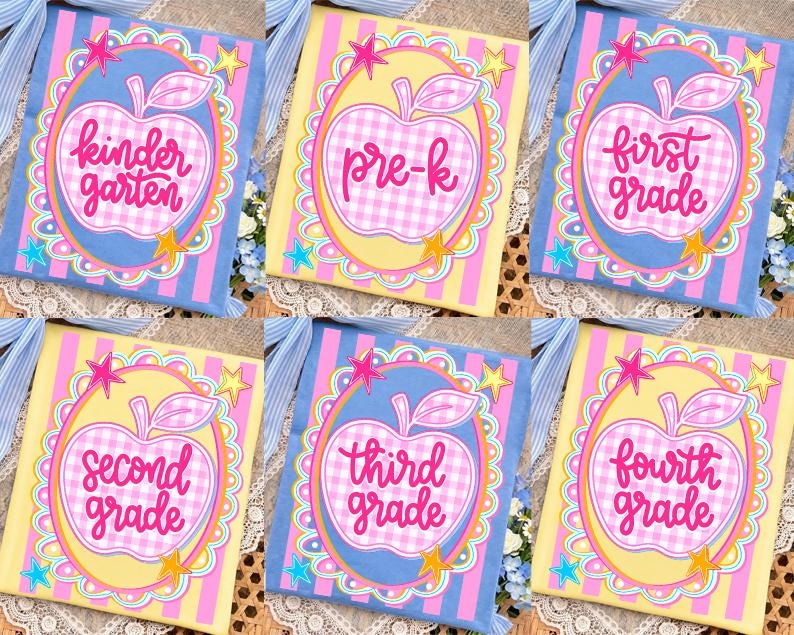 May include: A collection of six decorative school-themed books. Each book features a large apple design with the grade level written inside. The books are in various colors, including blue, yellow, and pink, with star accents.