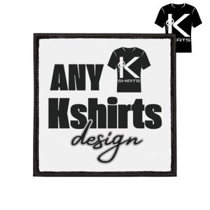 May include: A white square patch with black text that reads "ANY Kshirts design". A small black t-shirt graphic with a "K" design is above the word "shirts". A smaller version of the t-shirt graphic is in the upper right corner.