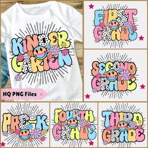 May include: White t-shirt with a colorful "Kindergarten" graphic, featuring a smiley face, flowers, and a sunburst design. Additional graphics display "First Grade", "Second Grade", "Pre-K", "Fourth Grade", and "Third Grade".