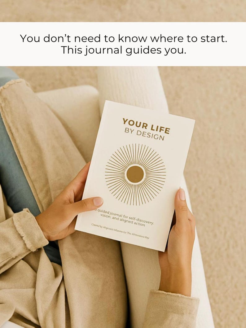 May include: A cream-colored journal titled "YOUR LIFE BY DESIGN" with a gold sunburst design. The journal is held open, revealing text about self-discovery and aligned action. The image also includes the text "You don't need to know where to start. This journal guides you."