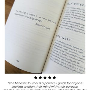 May include: An open book with text from "The Mindset Journal" is displayed. The pages show affirmations for self-esteem and wellness. A quote by Albert Einstein is also visible: "The mind that opens to a new idea will never return to its original size."