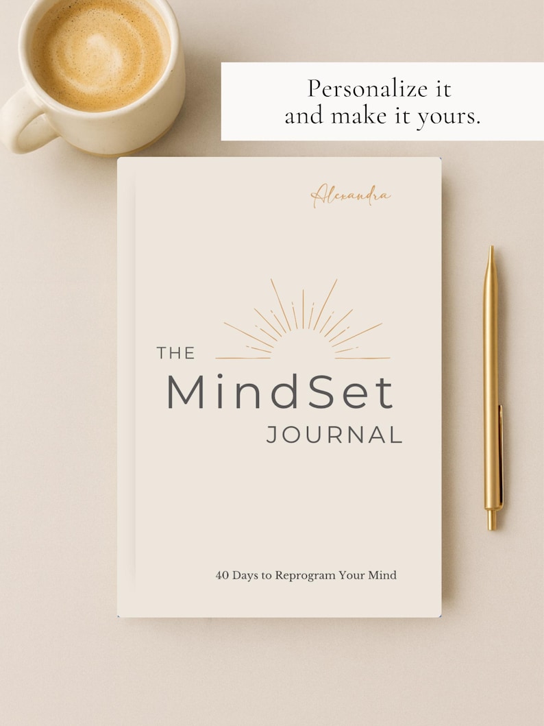 May include: A cream-coloured journal titled "The MindSet Journal" with gold accents and a gold pen. The journal has the text "40 Days to Reprogram Your Mind." A cup of coffee sits to the left. The text "Personalize it and make it yours" is at the top.