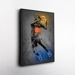 May include: Framed artwork featuring a basketball player in a dynamic pose, rendered in a neon-style design. The player is wearing a jersey with the number 11 and "NEW YORK" on the front. The basketball glows with yellow and orange, while the shoes are outlined in blue.