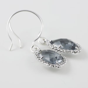 Charcoal Glass Earrings With A Shiny Silver Tone Chain Frame image 1