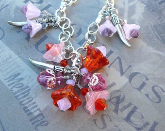 Red And Pink Bell Flower Necklace With Dagger Charms