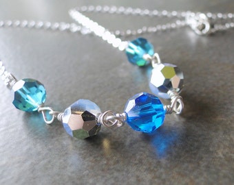 Blue And Silver Multi Facted Crystals Wire Wrapped To A Sterling Silver Chain