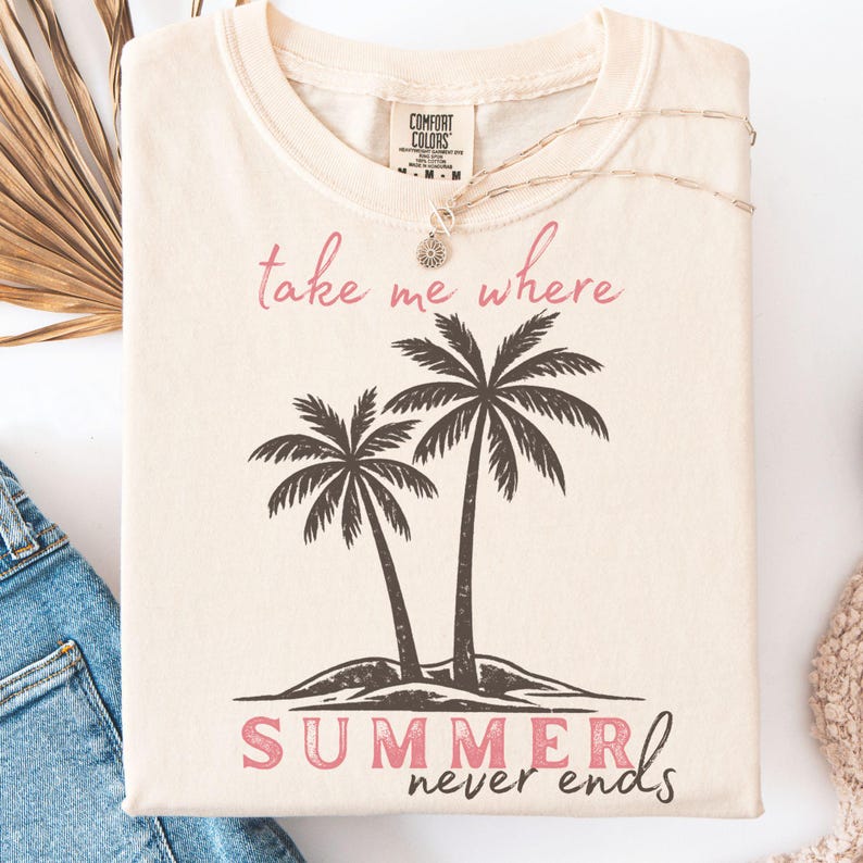 Retro beach graphic t-shirt featuring two vintage-style palm trees with the phrase “take me where summer never ends”