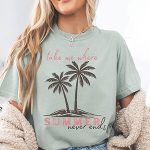 Retro beach graphic t-shirt featuring two vintage-style palm trees with the phrase “take me where summer never ends”