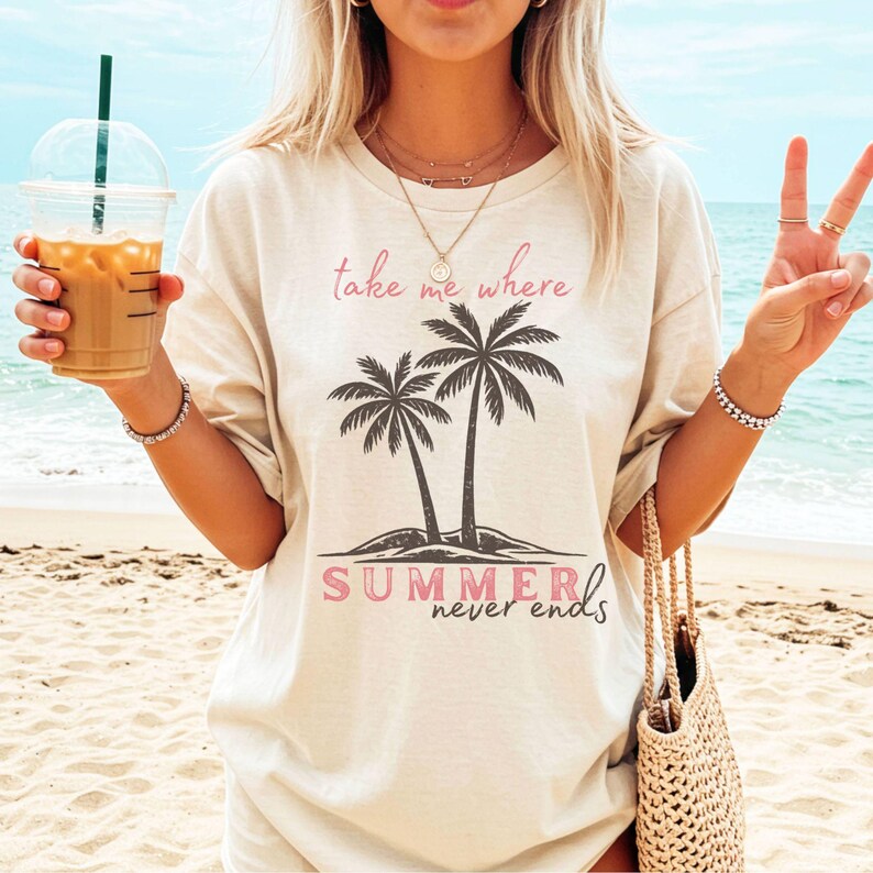 Retro beach graphic t-shirt featuring two vintage-style palm trees with the phrase “take me where summer never ends”