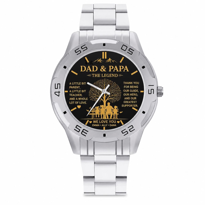 May include: A silver-toned analog wristwatch with a black dial featuring gold-colored text that reads DAD & PAPA THE LEGEND, along with a tree graphic, a family silhouette, and the names EMMA, ALLY, and DANA printed on the bottom of the watch face.