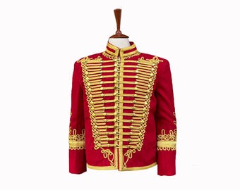 May include: A red jacket with gold trim and buttons. The jacket has a stand-up collar and long sleeves.