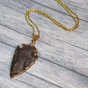 Gold Trimmed Flint Arrowhead Necklace: Minimalist Protection Amulet