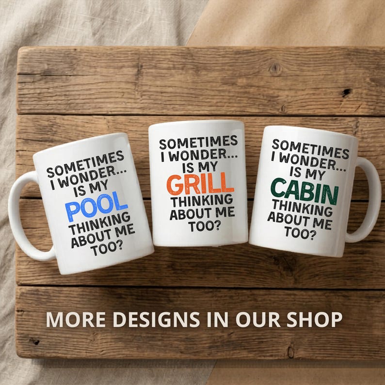 May include: Three white ceramic mugs with black text that reads "Sometimes I wonder... is my" followed by "POOL", "GRILL", and "CABIN" in blue, orange, and green, respectively. The mugs also say "Thinking about me too?" on a wooden surface.