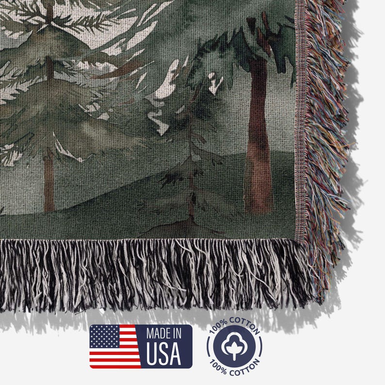 Detailed view of woven cotton threads on personalized couples blanket, forest trees and mountain design