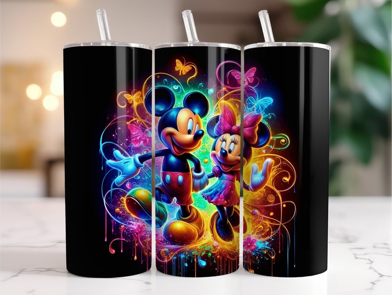 May include: Three black and stainless steel tumblers with a colorful design featuring Mickey Mouse and Minnie Mouse. The design includes colorful swirls, butterflies, and drips of paint.