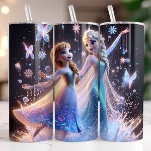 May include: Two stainless steel tumblers with a black background and a design featuring the characters Elsa and Anna from the movie Frozen. The design includes snowflakes, butterflies, and a sparkling effect.