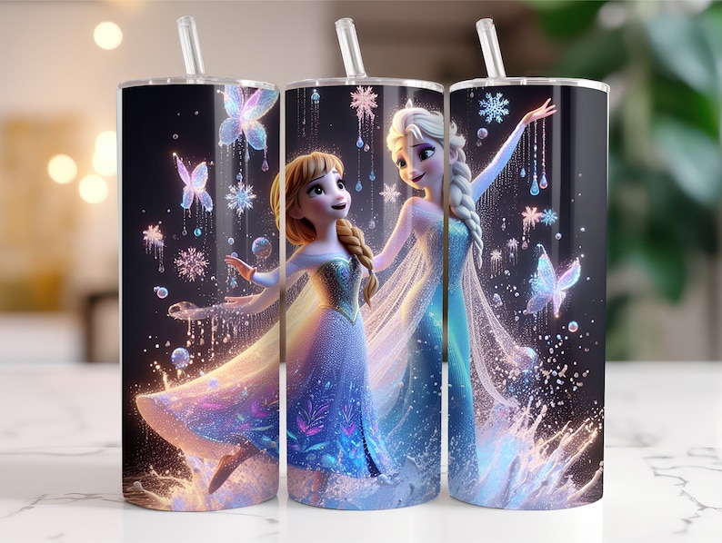 May include: Two stainless steel tumblers with a black background and a design featuring the characters Elsa and Anna from the movie Frozen. The design includes snowflakes, butterflies, and a sparkling effect.