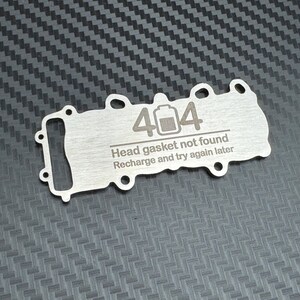 Electric car joke head gasket keychain