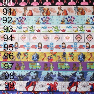 May include: A collection of colorful ribbon featuring various cartoon characters, including Disney characters, superheroes, and animals. The ribbon is numbered from 88 to 101.