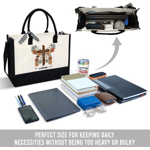 May include: A black and white canvas tote bag with a brown cross and floral design. The bag has a black bottom and a black strap. The bag is personalized with the name "emma".