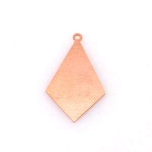 May include: A copper-colored diamond-shaped pendant with a hole at the top for hanging.