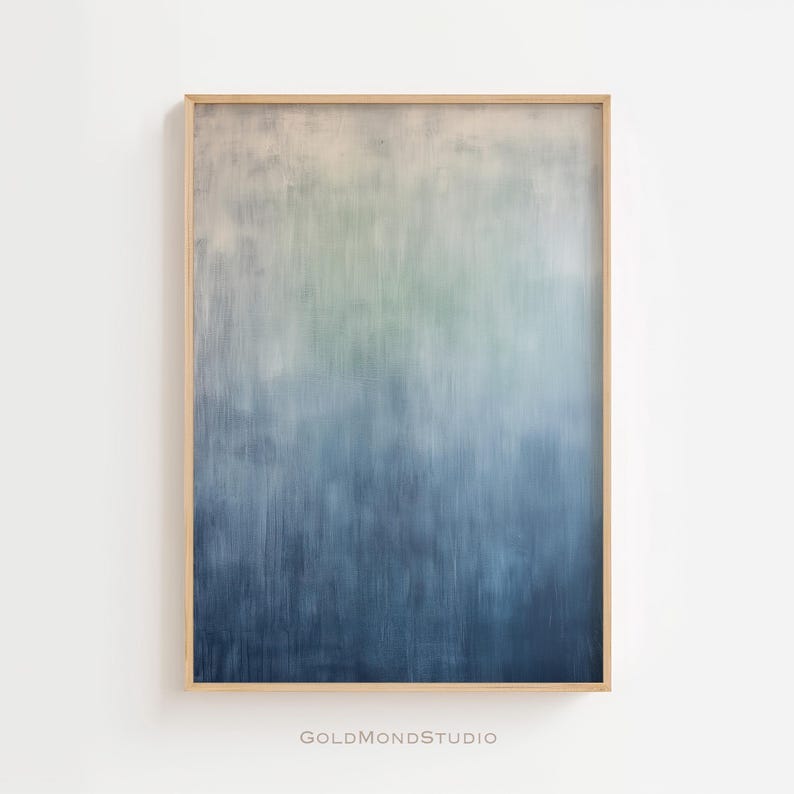 Pode incluir: Impress&atilde;o de arte abstrata emoldurada. A obra apresenta um gradiente de cores, passando do bege claro no topo a tons de azul na parte inferior. A pintura tem uma apar&ecirc;ncia texturizada, com pinceladas vis&iacute;veis.