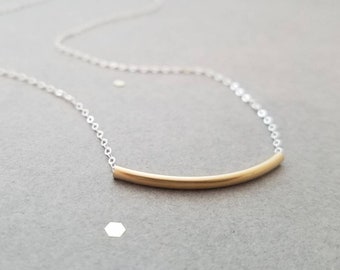 Simple sterling silver necklace with gold tube bead