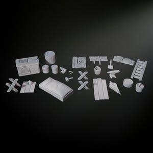 May include: A set of 18 miniature white plastic pieces for a tabletop game or miniature scene. The set includes a small building, a bed, a ladder, a forge, a bucket, a hammer, and various wooden planks and beams.