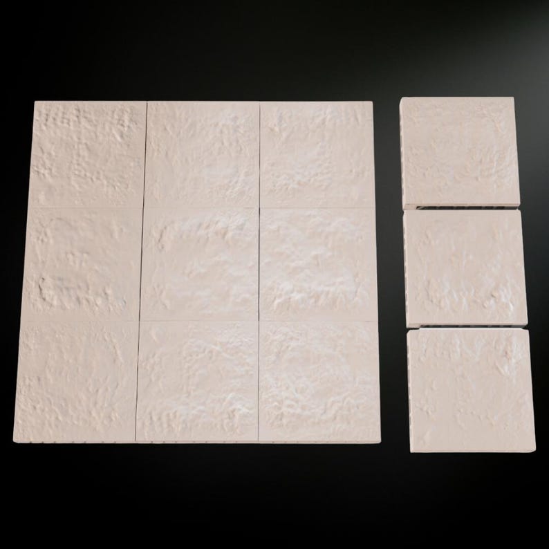 May include: A collection of beige, textured tiles arranged on a black surface. The tiles are square and have a rough, stone-like appearance. The arrangement includes a larger rectangular group and a smaller group of individual tiles.